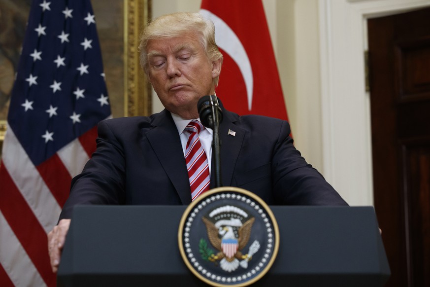 President Donald Trump listens as Turkish President Recep Tayyip Erdogan speaks in the Roosevelt Room of the White House in Washington, Tuesday, May 16, 2017. (AP Photo/Evan Vucci)