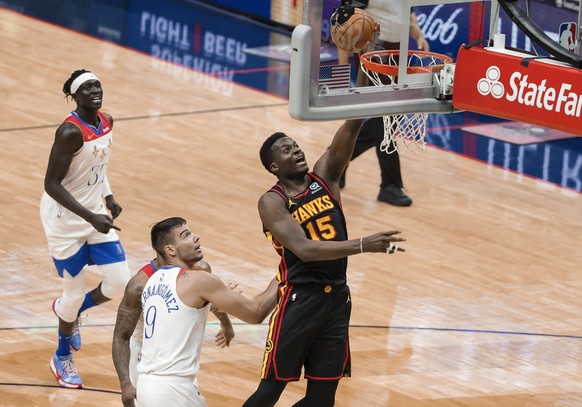 Atlanta Hawks center Clint Capela (15) shoots past New Orleans Pelicans center Willy Hernangomez (9) in the second quarter of an NBA basketball game in New Orleans, Friday, April 2, 2021. (AP Photo/De ...