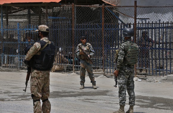 Pakistan and Afghan soldiers stand guard at Torkham border crossing, in Khyber district, Pakistan, Tuesday, Aug. 3, 2021. Pakistan&#039;s military said it completed 90 percent of the fencing along the ...