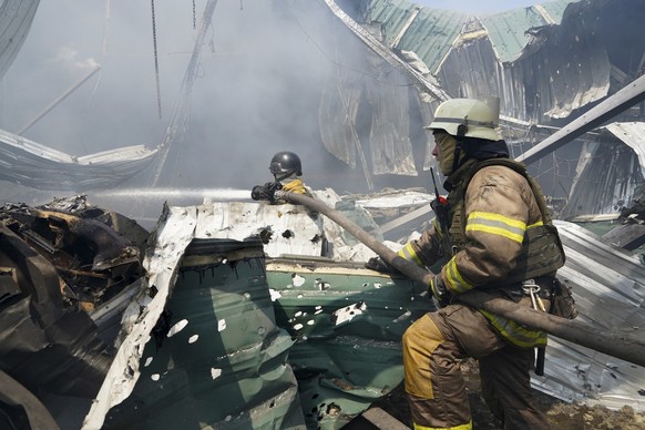 Firefighters put out a fire after a Russian missile hit a large printing house in Kharkiv, Ukraine, Thursday, May 23, 2024. Russian missiles slammed into Ukraine&#039;s second-largest city in the nort ...