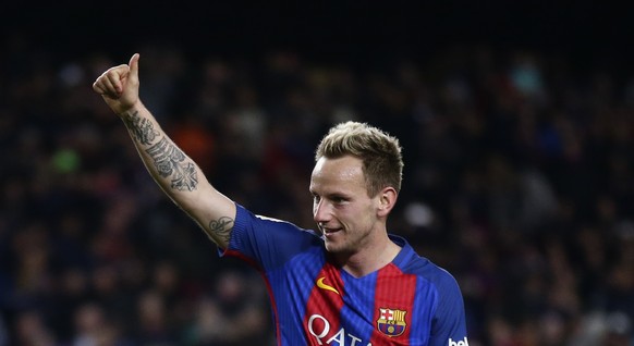 FC Barcelona&#039;s Ivan Rakitic celebrates after scoring during the Spanish La Liga soccer match between FC Barcelona and Celta Vigo at the Camp Nou in Barcelona, Spain, Saturday, March 4, 2017. (AP  ...