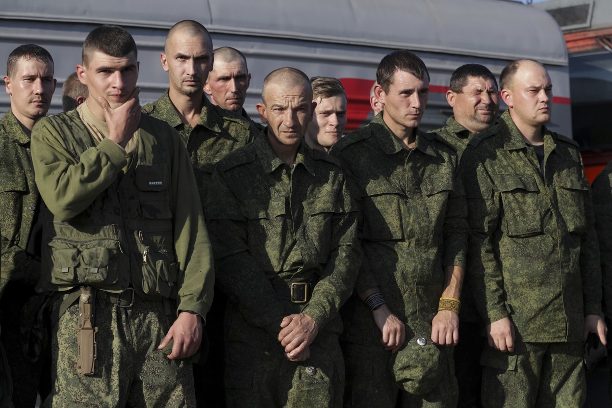 FILE - Russian recruits stand waiting to take a train at a railway station in Prudboi, Volgograd region of Russia, Sept. 29, 2022. Since Russian President Vladimir Putin announced his mobilization on  ...