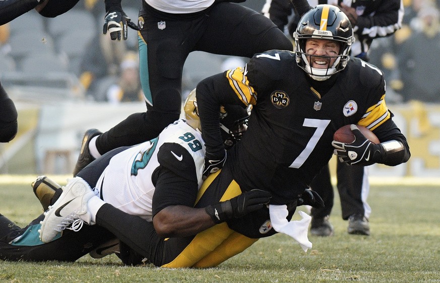 Pittsburgh Steelers quarterback Ben Roethlisberger (7) is brought down by Jacksonville Jaguars defensive tackle Marcell Dareus (99) during the first half of an NFL divisional football AFC playoff game ...