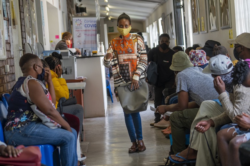 Volunteers wait to be checked at a vaccine trial facility for AstraZeneca at Soweto&#039;s Chris Sani Baragwanath Hospital outside Johannesburg, South Africa, Monday Nov. 30, 2020. With Americans, Bri ...