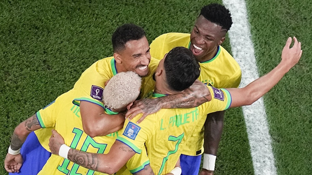 Teammates celebrate with Brazil's Lucas Paqueta who scored his side's fourth goal during the World Cup round of 16 soccer match between Brazil and South Korea, at the Education City Stadium  ...