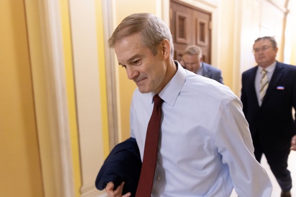 epa10925627 Republican Representative of Ohio Jim Jordan (L) walks to a meeting before another vote on the House floor for him to be the next Speaker of the House, in the US Capitol in Washington, DC, ...