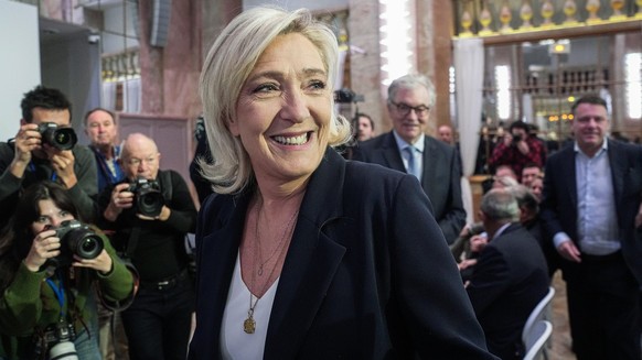 French far-right National Rally party leader Marine Le Pen arrives for the New Year's address to the media in Paris, Monday, January 15, 2024. (AP Photo/Michel Euler)