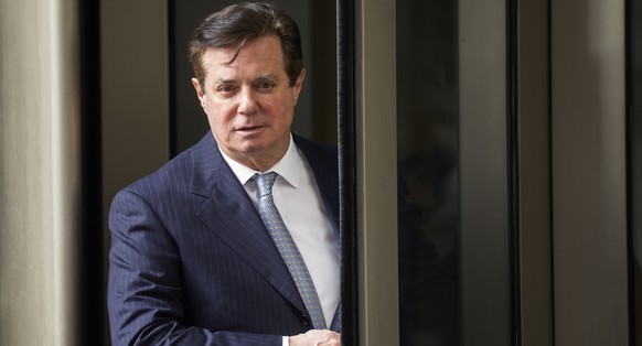 epa06963986 (FILE) - Former Trump campaign chairman Paul Manafort departs the federal court house after a status hearing in Washington, DC, USA, on 14 February 2018 (reissued 22 August 2018). Manafort ...