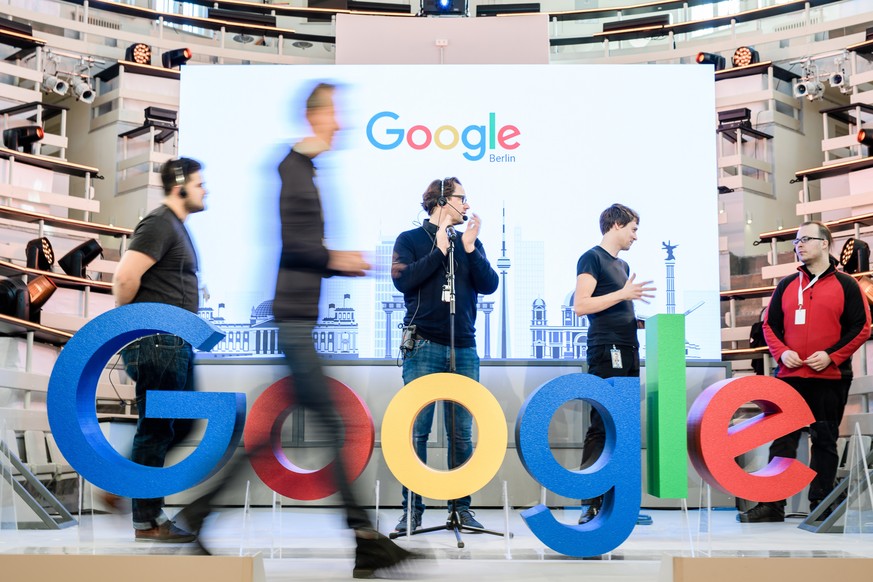 epa07308772 Workers prepare the stage prior to a photocall on the occasion of the opening of the new Google office in Berlin, Germany, 22 January 2019. On 22 January 2019 Google sets up a new office i ...