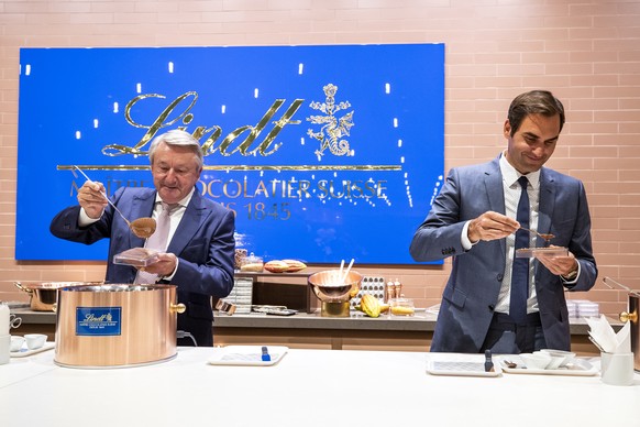 IMAGE DISTRIBUTED FOR LINDT AND SPRUENGLI - Ernst Tanner, Chairman of the Board, Lindt and Spruengli, left, and Roger Federer, Lindt Brand Ambassador and sportsman, inaugurate the brand new Chocolater ...