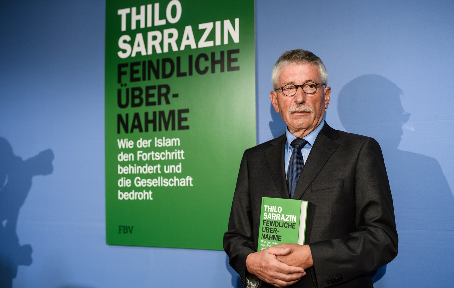 epa06983222 Former Berlin Senator for Finance and Executive Board member of the Bundesbank, Thilo Sarrazin, poses at the podium during the presentation of his new book, &#039;Feindliche Uebernahme. Wi ...