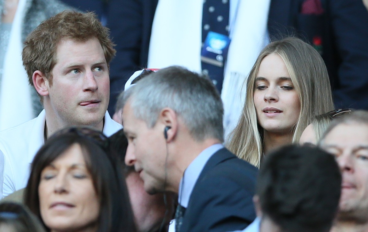 FILE - A Sunday, March 9, 2014 photo from files showing Britain's Prince Harry, top left, with his girlfriend Cressida Bonas, top right, as they attend the Six Nations Rugby Union match between E ...