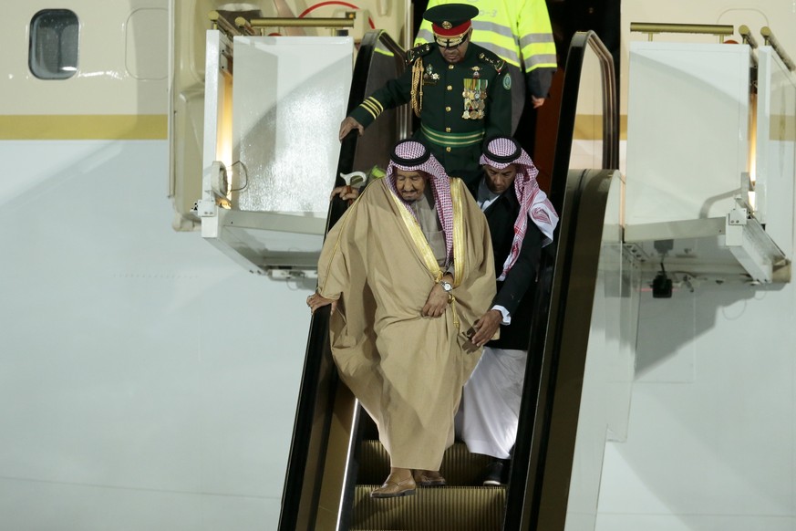 Saudi King Salman steps out of a plane upon arrival in Moscow&#039;s Government Vnukovo airport, Russia, Wednesday, Oct. 4, 2017. Salman will meet Russian President Vladimir Putin on Thursday, Oct. 5, ...