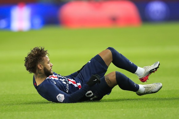 PSG's Neymar lies on the ground during French League One soccer match between Paris Saint-Germain and Lille at the Parc des Princes stadium in Paris, Friday, Nov. 22, 2019. (AP Photo/Michel Euler ...