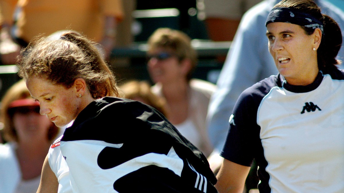 Switzerland's Patty Schnyder, left, walks off the court Saturday, April 17, 2004 after refusing to shakehands with opponent Conchita Martinez, of Spain, after losing in straight sets, 6-4, 6-3 in ...