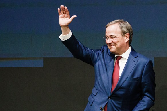 epa09457552 Christian Democratic Union (CDU) party chairman and top candidate for the upcoming federal elections Armin Laschet waves to participants during an EPP Group Bureau meeting in Berlin, Germa ...