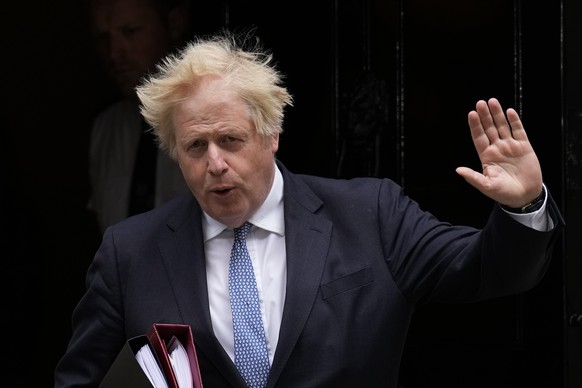 FILE - British Prime Minister Boris Johnson leaves 10 Downing Street to attend the weekly Prime Minister&#039;s Questions at the Houses of Parliament, in London, on May 25, 2022. Former Prime Minister ...