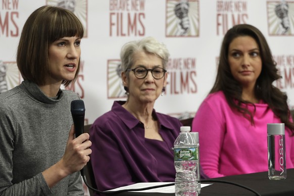 Rachel Crooks, left, Jessica Leeds, center, and Samantha Holvey attend a news conference, Monday, Dec. 11, 2017, in New York to discuss their accusations of sexual misconduct against Donald Trump. The ...