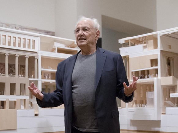 Architect Frank Gehry poses for photographs in front of a model that helps illustrate the Philadelphia Museum of Art&#039;s master plan, on Thursday, June 26, 2014, in Philadelphia. A massive renovati ...