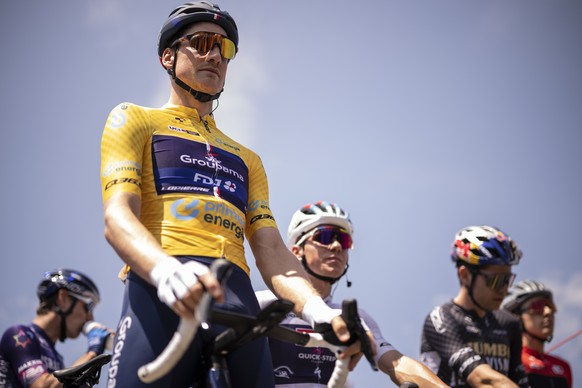 Stefan Kueng from Switzerland of Groupama-FDJ waring the Yellow Jersey of the overall leader looks on ahead of the start to the third stage, a 143.8 km race from Tafers to Villars-sur-Ollon, at the 86 ...