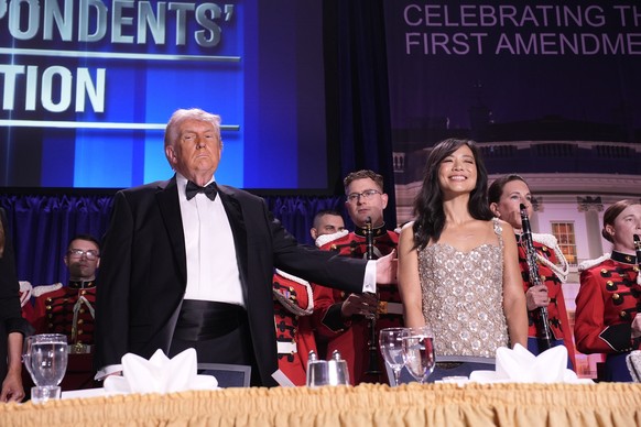 epa12914507 US President Donald Trump (L) and CBS News senior White House correspondent Weijia Jiang participate in the White House Correspondents' Association Dinner in Washington, DC, USA, 25 A ...