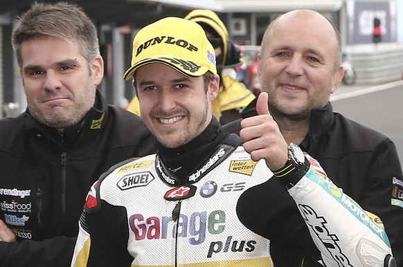 Moto2 rider Thomas Luthi of Switzerland gives a thumbs-up after taking pole position for the Australian Motorcycle Grand Prix at Phillip Island, Australia, Saturday, Oct. 22, 2016. (AP Photo/Rob Griff ...