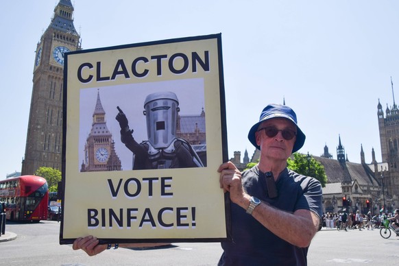 July 8, 2026, London, England, United Kingdom: An activist holds a placard urging Clacton to vote for the satirical candidate Count Binface during the weekly anti-Brexit and pro-EU protest in Parliame ...