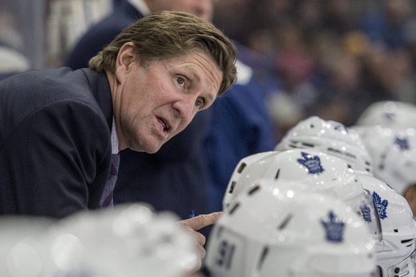 FILE - In this Oct. 4, 2016, file photo, Toronto Maple Leafs head coach Mike Babcock speaks to his players as they take on the Ottawa Senators during the first period of an NHL preseason hockey game i ...