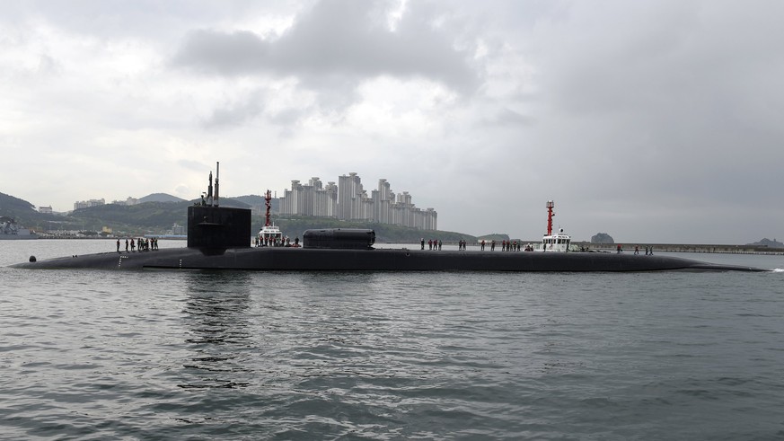 epa05926230 A handout photo made available by the United States Department of Defense (DoD) shows the Ohio-class guided-missile submarine USS Michigan (SSGN 727) arriving in Busan, South Korea, 25 Apr ...