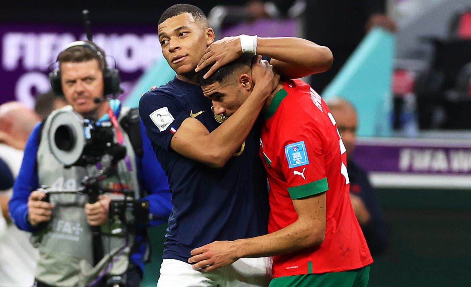 epa10366288 Kylian Mbappe (L) of France and Achraf Hakimi (R) of Morocco react after the FIFA World Cup 2022 semi final between France and Morocco at Al Bayt Stadium in Al Khor, Qatar, 14 December 202 ...