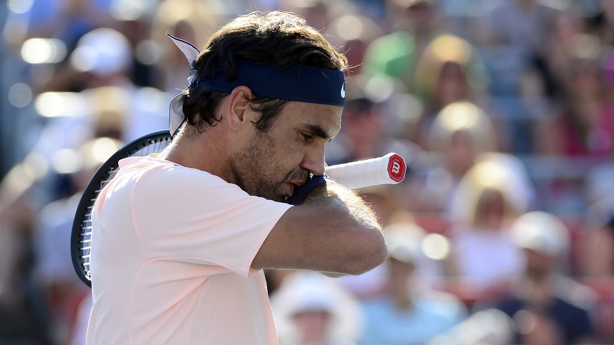 Roger Federer, of Switzerland, reacts during a break in play against Alexander Zverev, of Germany, during the final of the Rogers Cup tennis tournament Sunday, Aug. 13, 2017, in Montreal. (Paul Chiass ...