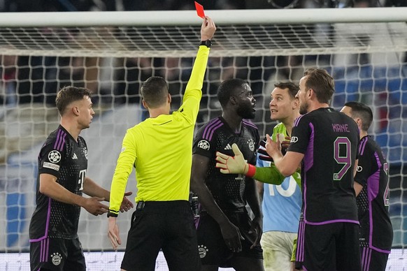 Bayern&#039;s Dayot Upamecano receives a red card by referee Francois Letexier during a Champions League round of 16 first leg soccer match between Lazio and Bayern Munich, at Rome&#039;s Olympic Stad ...