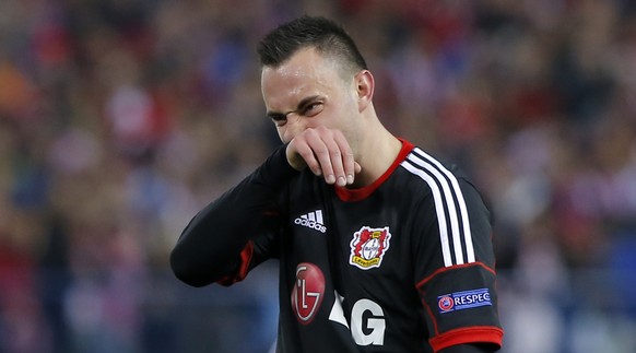Leverkusen's Josip Drmic rubs his face during the Champions League round of sixteen second leg soccer match between Atletico de Madrid and Bayer 04 Leverkusen at the Vicente Calderon stadium in Madrid, Spain, Tuesday, March 17, 2015. (AP Photo/Andres Kudacki)  