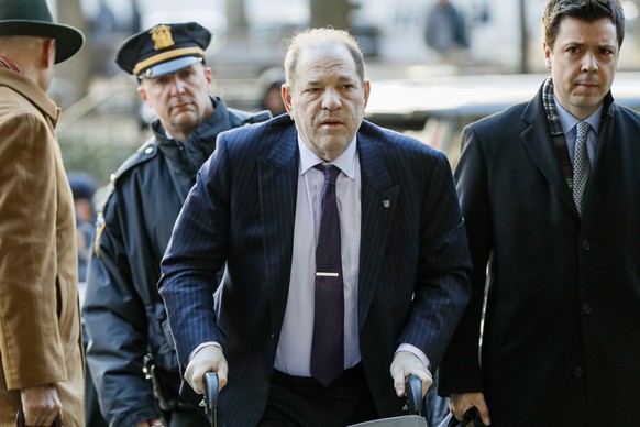 FILE - Harvey Weinstein arrives at a Manhattan courthouse as jury deliberations continue in his rape trial on Feb. 19, 2020, in New York. British prosecutors said Wednesday, June 8, 2022, they have au ...