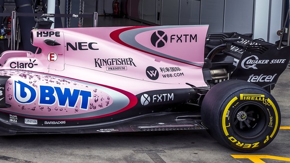 epa05867087 Mexican Formula One driver Sergio Perez (L) and French Formula One driver Esteban Ocon (R) of Sahara Force India F1 Team stand next to the car during the photo call at the first practice s ...