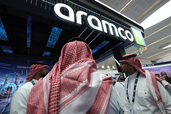 epa12500189 Visitors gather at the Saudi Arabian Oil Company (Aramco) stand during the Abu Dhabi International Petroleum Exhibition and Conference (ADIPEC) in Abu Dhabi, United Arab Emirates, 03 Novem ...