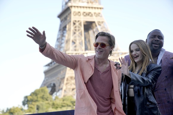 Actor Brad Pitt, left, Actress Joey King, Actor Brian Tyree Henry pose during a photo call for the film &#039;Bullet Train&#039; in Paris, France, Saturday, July 16, 2022. (AP Photo/Christophe Ena)