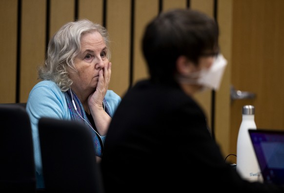 FILE - Romance writer Nancy Crampton Brophy, left, accused of killing her husband, Dan Brophy, in June 2018, watches proceedings in court in Portland, Ore., Monday, April 4, 2022. A jury in Portland,  ...