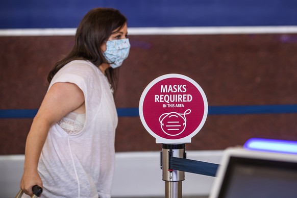 epa08523640 A passenger checks in for a Delta Air Lines flight inside the main domestic terminal ahead of the Fourth of July holiday travel weekend at Hartsfield-Jackson Atlanta International Airport  ...