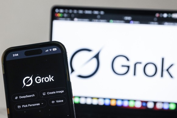 epa12644240 The Grok artificial intelligence (AI) website is displayed on a mobile phone as a nationwide restriction on the service takes effect, in Shah Alam, outside Kuala Lumpur, Malaysia 12 Januar ...