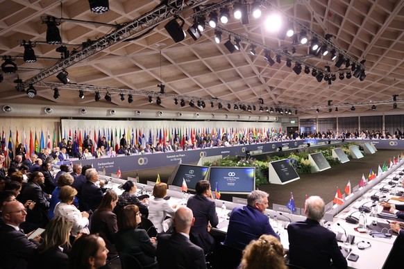 epa11413239 Attendees sit in the plenary at at the Summit on Peace in Ukraine at the Buergenstock Resort, Switzerland, 15 June 2024. International heads of state gather on 15 and 16 June at the Buerge ...