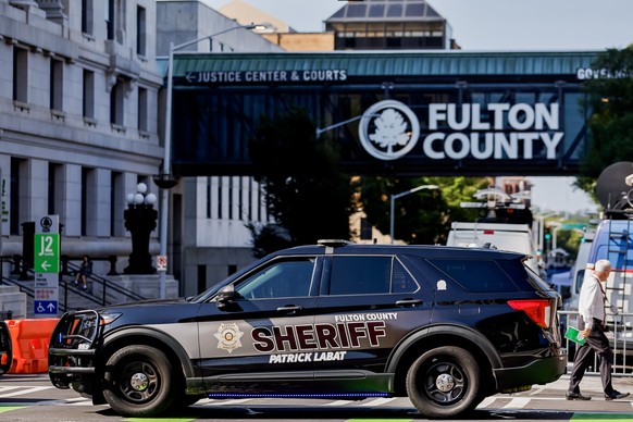 epa10800161 Enhanced security measures are implemented outside the Fulton County Courthouse and Justice Center ahead of a possible grand jury indictment against former US President Donald Trump for 20 ...