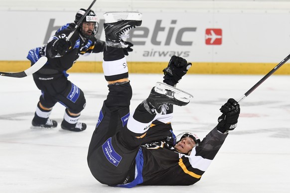 Lugano&#039;s Ryan Gardener, down, celebrates after scoring 3-1, during the game between HC Lugano and Avtomobilist Yekaterinburg, at the 90th Spengler Cup ice hockey tournament in Davos, Switzerland, ...