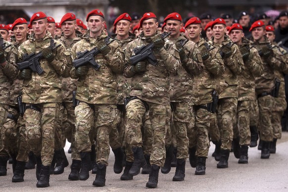 Members of the Republic of Srpska Police Forces march during a parade to mark the 31st anniversary of the Republic of Srpska in Istocno Sarajevo, Bosnia, Monday, January 9, 2023. Thousands of flags wave...