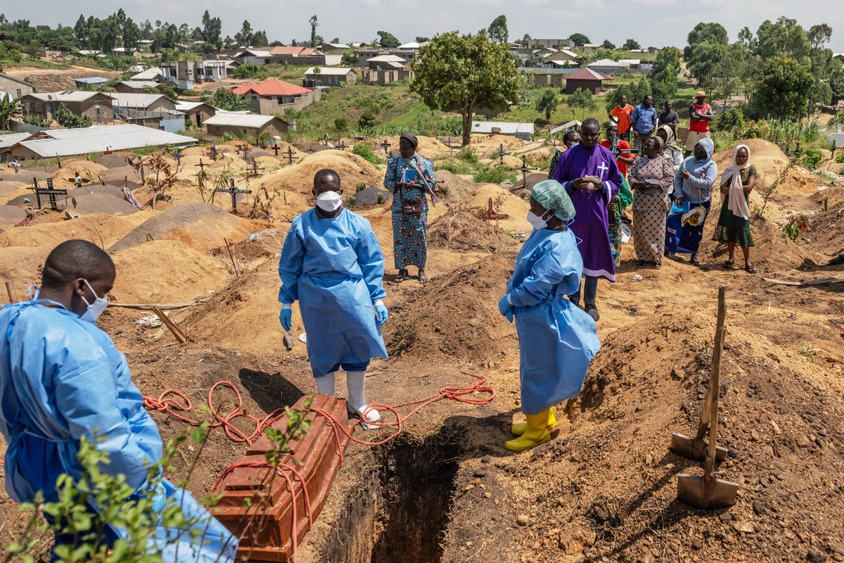 KEYPIX - Red Cross workers prepare to bury Vanisa Anifa, a 6-month-old orphaned girl who died of Ebola, at the Bigo Cemetery, in Bunia, Congo, Friday, June 19, 2026. (AP Photo/Moses Sawasawa)
