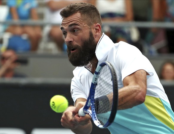 France&#039;s Benoit Paire makes a backhand return to Croatia&#039;s Marin Cilic during their second round singles match at the Australian Open tennis championship in Melbourne, Australia, Wednesday,  ...