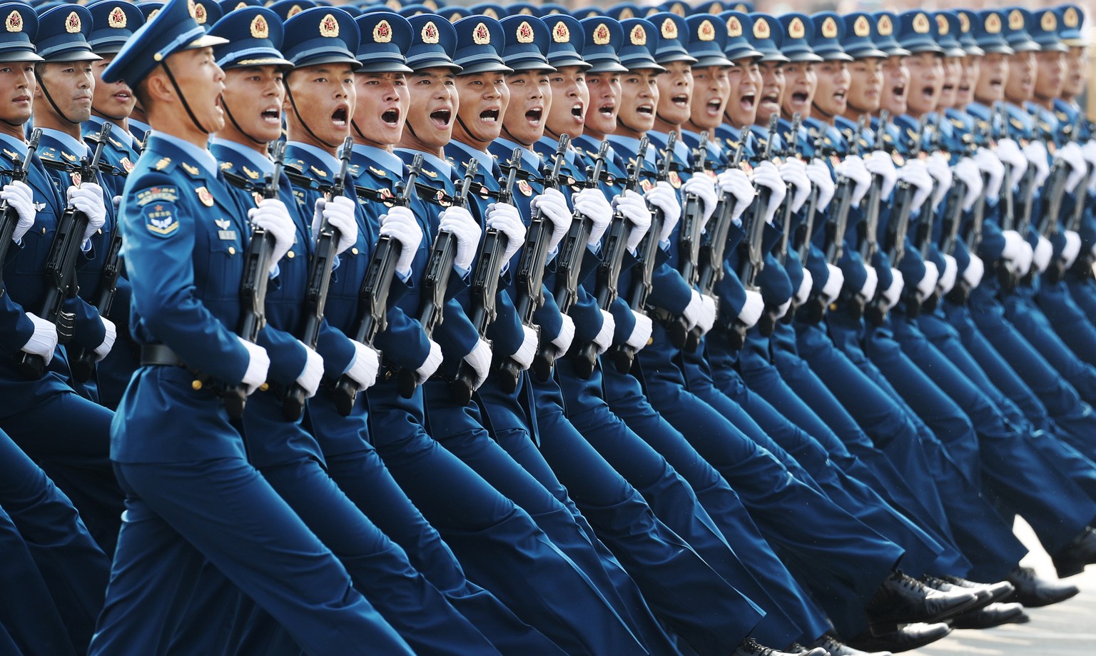 epa07971375 YEARENDER 2019 OCTOBER.Military troops march past Tiananmen Square during a military parade marking the 70th anniversary of the founding of the People&#039;s Republic of China, in Beijing, ...