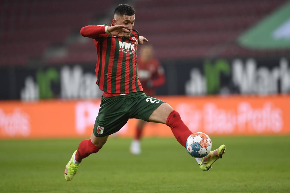 Augsburg's Andi Zeqiri takes control of the ball during the German Bundesliga soccer match between Eintracht Frankfurt and FC Augsburg at the WWK Arena in Augsburg, Germany, Sunday, Jan. 16, 2022 ...