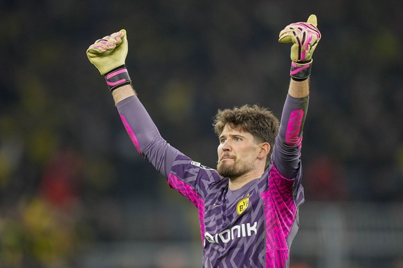 Dortmund&#039;s goalkeeper Gregor Kobel celebrates at the end of the Champions League round of 16 second leg soccer match between Borussia Dortmund and PSV Eindhoven at the Signal Iduna Park in Dortmu ...