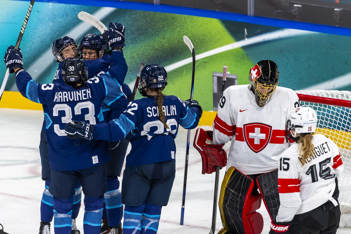 Finland's Sanni Vanhanen #12 (3rd left) celebrates his goal with her teammates after scoring the 1:3, during the women's group A preliminary round game between Finland and Switzerland at the ...